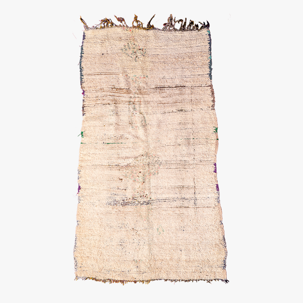 Handgeweven neutraal berber tapijt met subtiele textuurvariaties en organische kleurnuances, perfect voor elk interieur.